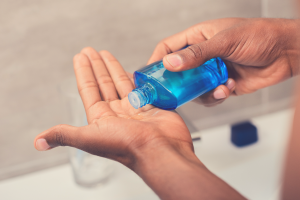 black man using aftershave