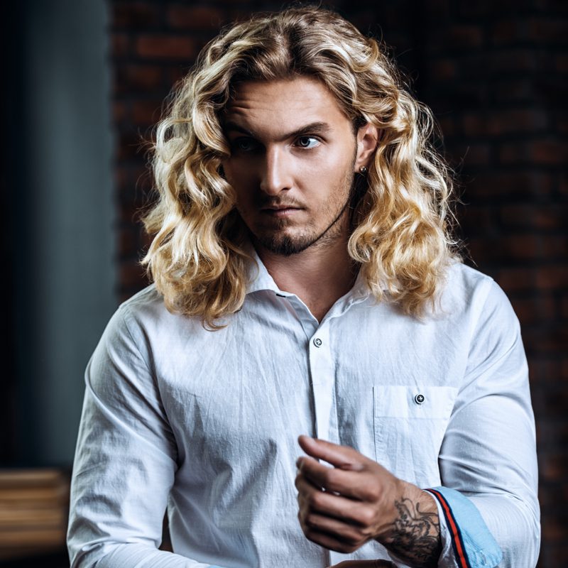 Long Blonde Curly Haired Man